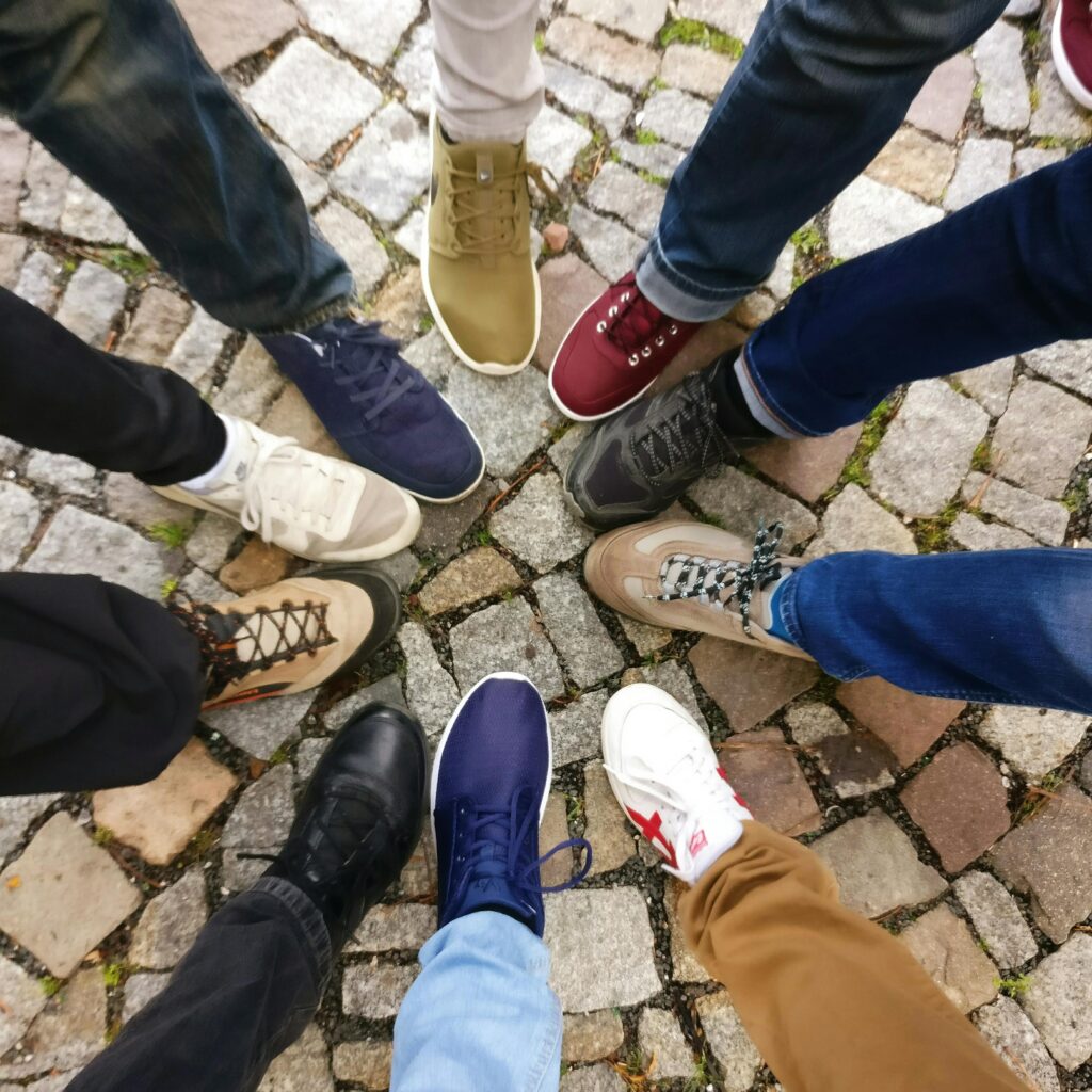 pexels-photo-609771-609771 People Forming Round by Shoes